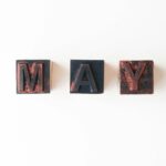 brown and black letter m