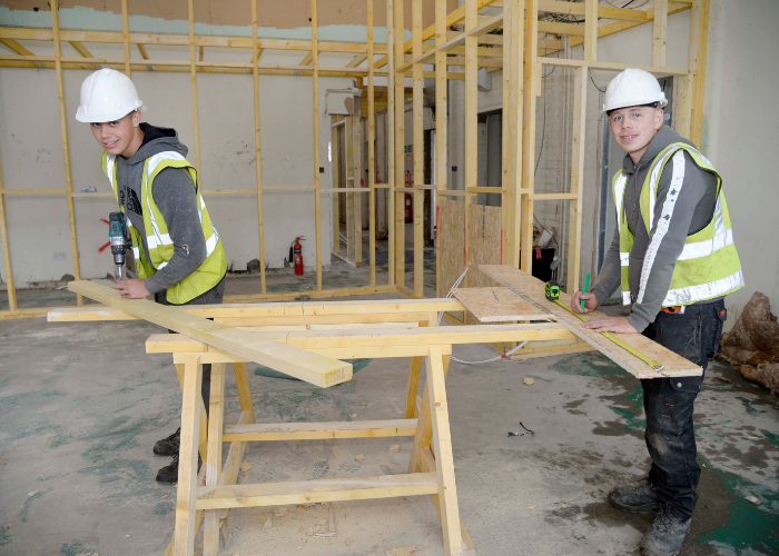 Apprentices James Thomas and Jay Hale learn new skills at J.G. Hale Construction