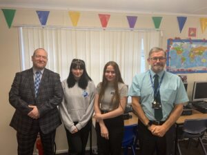 Owain-Mears-Flexible-Learning-Teacher-and-Rob-Wilson-Assistant-Head-Teacher-with-two-students-from-Llanishen-High-School-002-scaled