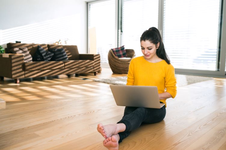 graphicstock-beautiful-young-woman-at-home-sitting-on-the-floor-working-on-laptop-writing-something_rul8uNuIG-