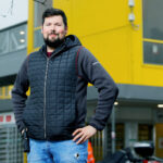 Apprentice Nathan Martin outside the CWL1 Amazon Fulfillment Centre near Swansea, Wales, UK