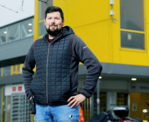 Apprentice Nathan Martin outside the CWL1 Amazon Fulfillment Centre near Swansea, Wales, UK