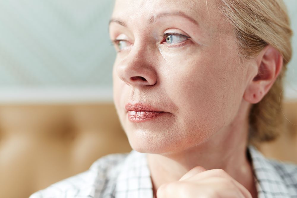 small-storyblocks-headshot-of-pretty-middle-aged-woman-with-deep-gray-eyes-looking-away-pens-SBI-325331509