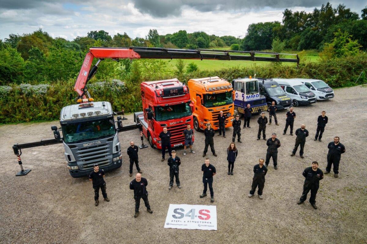 The S4S team with some of their fleet of vehicles.jpgLR.jpg