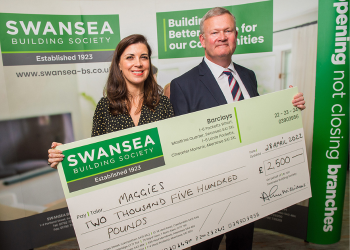 Alun Williams Chief Executive at Swansea Building Society presents a cheque for 2500 to Lucia Osmond Centre Fundraising Manager at Maggies