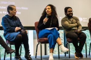 Actor Alexandria Riley sits on a panel with 2 others during the Foot In The Door final event