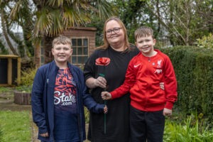 Amy Olsen and her sons Max and Theo pictured with their Remember Me Rose