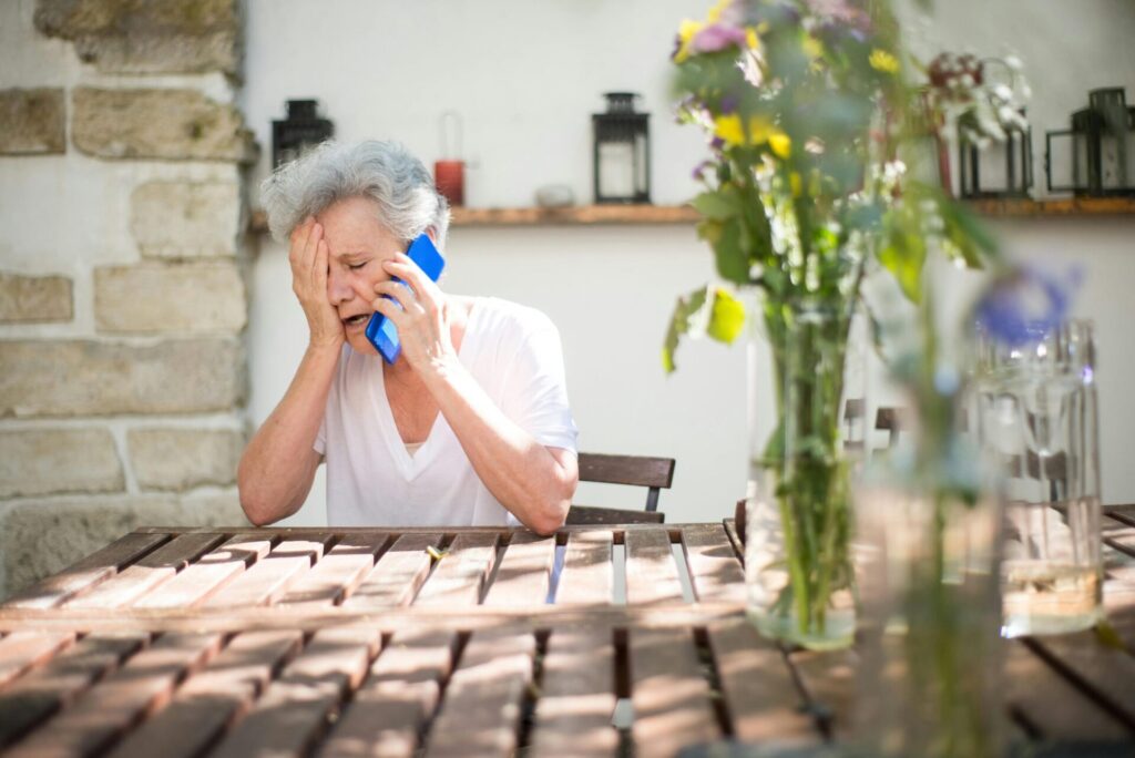 Bereaved woman on phone dealing with sadmin pexels-kampus-8871524 (2)
