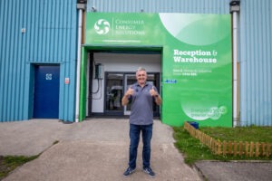 CES ambassador, Jonathan Davies, stood in front of CES' new Treorchy facility.