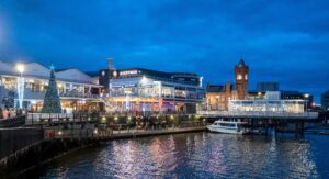 Cardiff Bay lit up at night with Christmas lights.