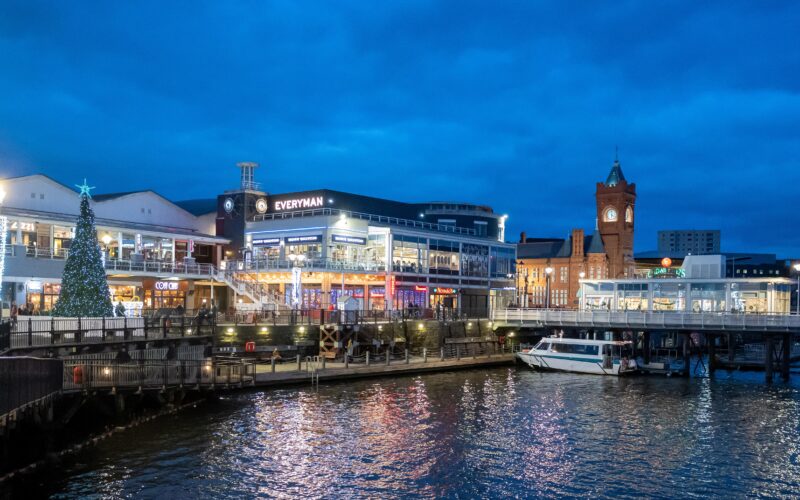 Cardiff Bay lit up at night with Christmas lights.