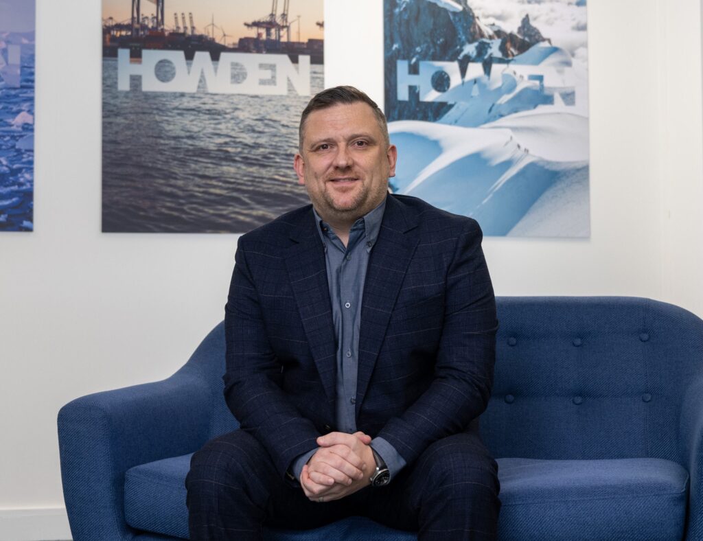 Man sitting on a blue sofa