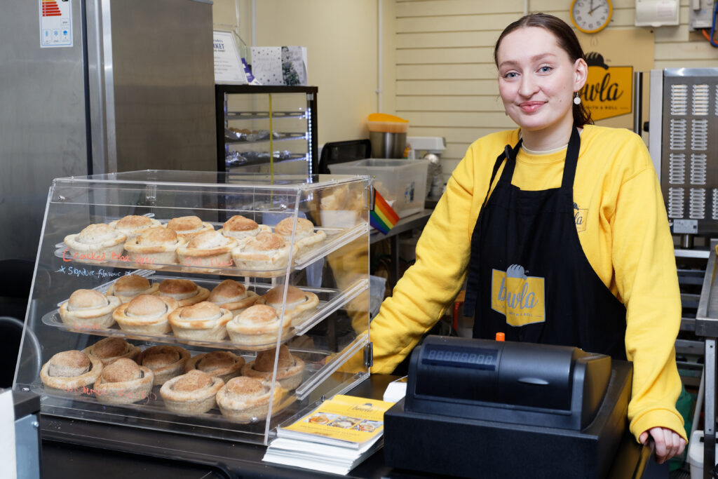 Hannah Worth, who has founded Bowla, a company serving food in a bowler hat shaped bread in Swansea Market, Swansea, Wales, UK