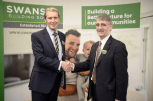 Swansea Building Society's outgoing Chair, Ieuan Griffiths (right), with Stephen Maddock, new Chair (left).