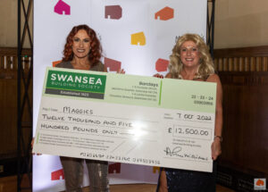 Jane Parker, Swansea Building Society, presenting a cheque for £12,500 to a representative of Maggies Cancer Charity