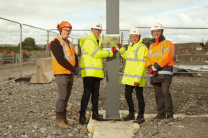 Pentre Awel 3.8.23 (LtR) Peter Sharpe (Bouygues UK), Cllr Daren Price, Cllr Gareth John, Stephen Davies (Bouygues UK).