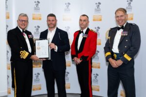 Ian Williams, Regimental Cleaning Services Founder, receiving Regimental Cleaning Services the prestigious Defence Employer Recognition Gold Award.