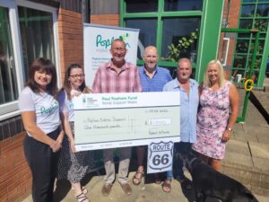 Robert Williams and members of the Ynys Lodge presenting Popham Kidney Support with its donation