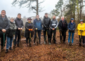 Staff from Swansea Building Society plant 100 trees at Penllergare Valley Woods to celebrate centenary