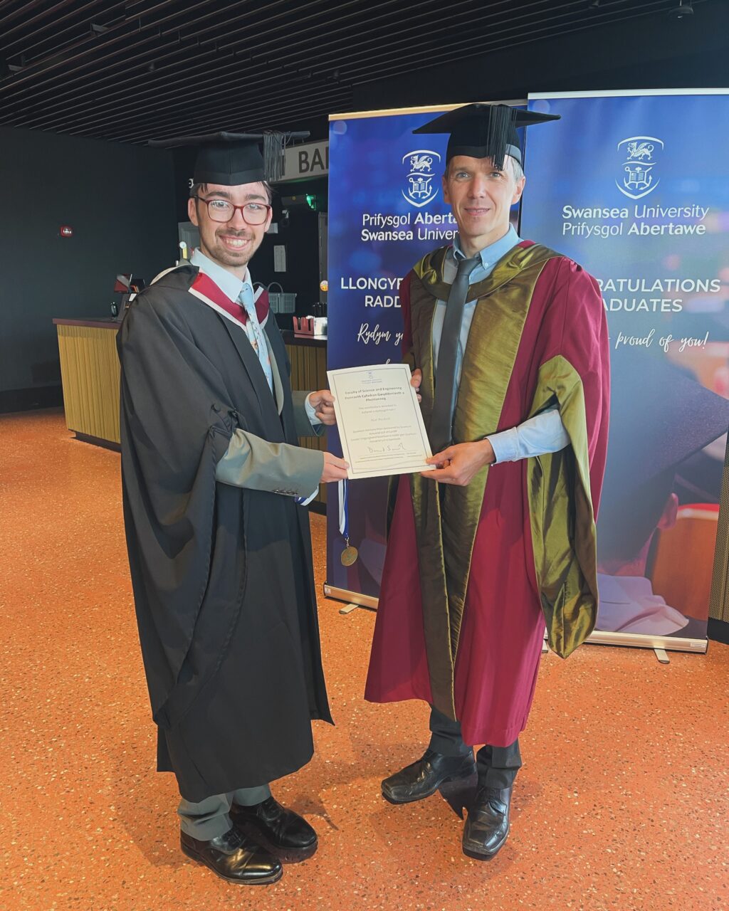 Swansea University graduate Hal Peckett with Dr Kristian Evans