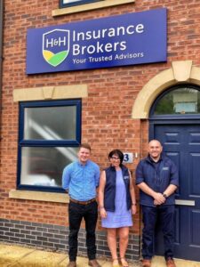 The H&H Insurance Brokers team of Tomos Jones, HÃ¢f Rowley and Lee Baines outside the Wrexham office