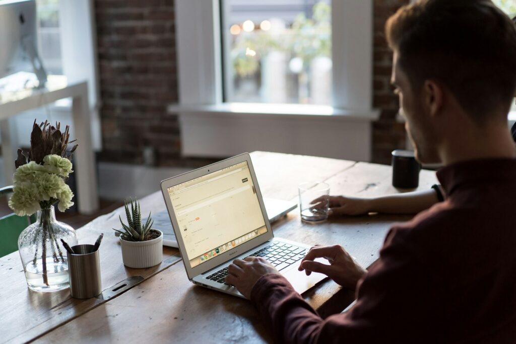 Business professional using computer to utilize contact center software