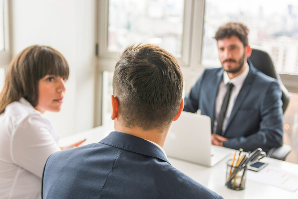 businessman-businesswoman-sitting-front-manager-workplace