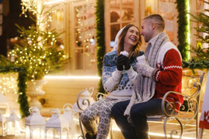 christmas-eve-charming-couple-two-romantic-people-are-enjoying-hot-drinks-while-sitting-bench