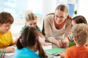 happy-teacher-listening-her-students