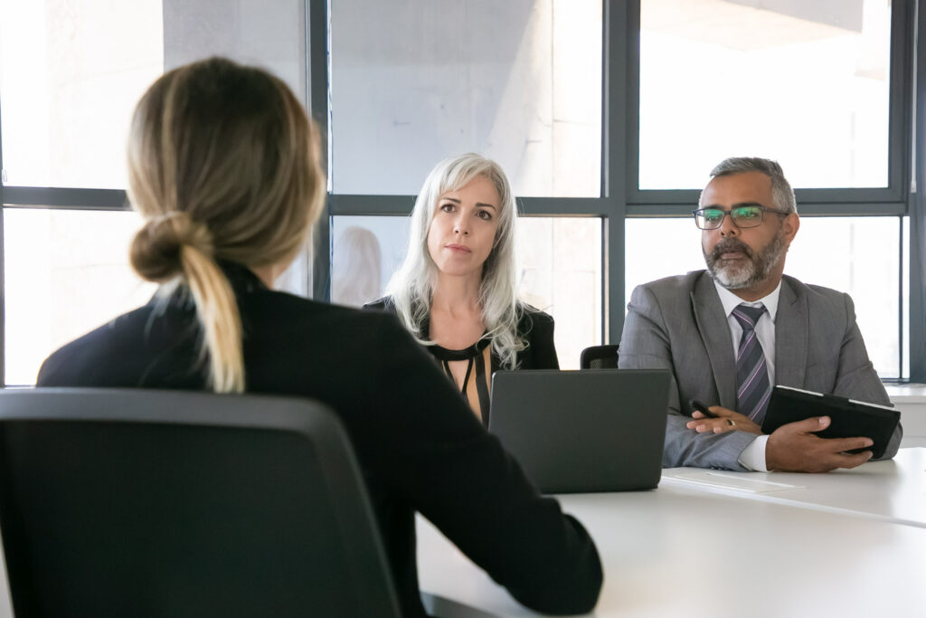 serious-employer-hr-manager-talking-job-candidate-interview-back-view-closeup-human-resource-career-concept