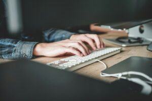 person using computer keyboard